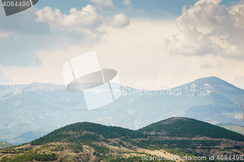 Image of Beautiful scenery with hills and mountains in the distance