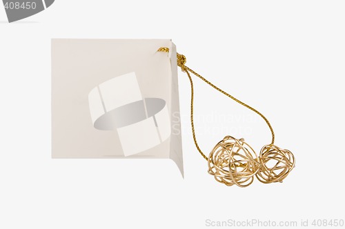 Image of Isolated gift paper label with golden balls for a celebration