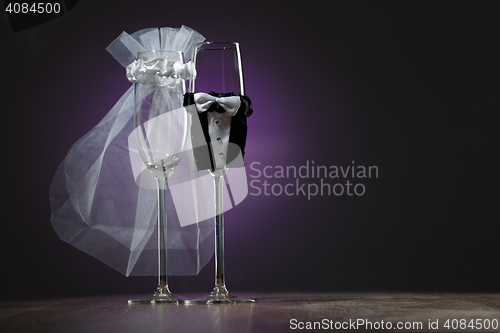 Image of Two empty decorated champagne glasses for wedding party