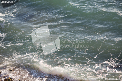 Image of Beautiful small sea waves near the shore