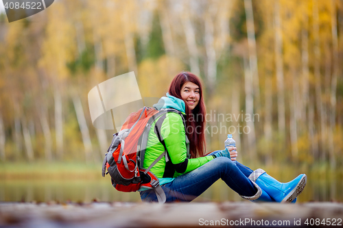 Image of Long-haired brunette with backpack