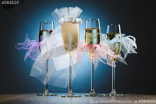 Image of Set of festive glasses with champagne for wedding party