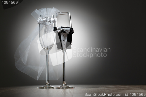 Image of Two empty decorated champagne glasses for wedding party