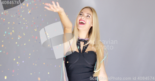 Image of Happy sexy blond young girl having fun on a party