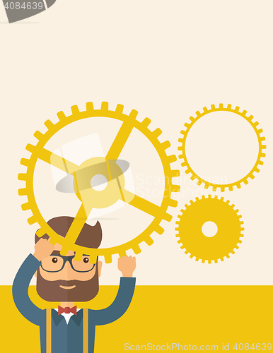 Image of Businessman holding up gears