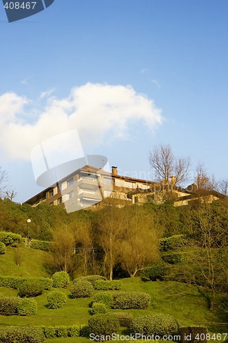Image of Construction House architecture building with a garden in a residential area.