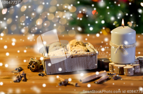 Image of close up of christmas oat cookies on wooden table