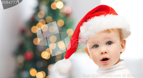 Image of beautiful little baby boy in christmas santa hat
