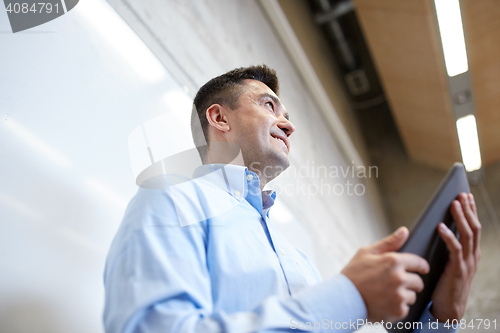 Image of teacher or lector with tablet pc at lecture