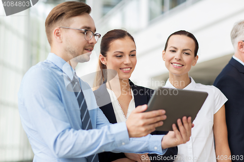 Image of business people with tablet pc computer at office