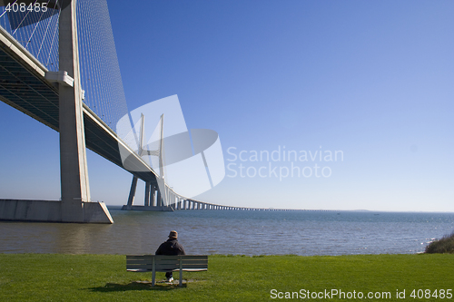 Image of Lonely senior by the bridge