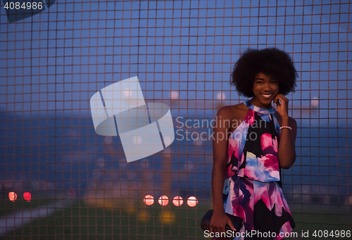 Image of portrait of a young African-American woman in a summer dress