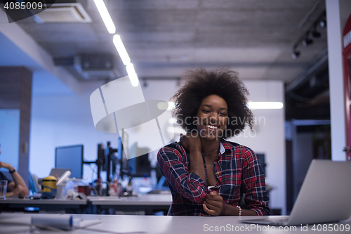 Image of portrait of a young successful African-American woman in modern 