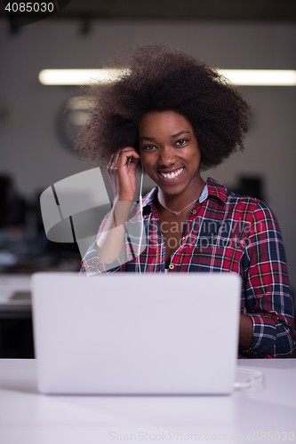 Image of portrait of a young successful African-American woman in modern 