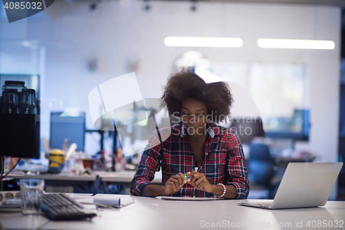 Image of portrait of a young successful African-American woman in modern 