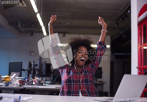 Image of portrait of a young successful African-American woman in modern 