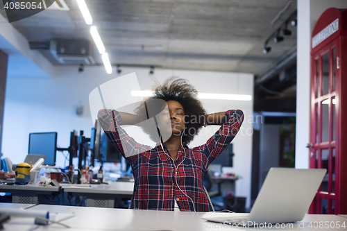 Image of portrait of a young successful African-American woman in modern 