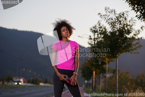 Image of Portrait of a young african american woman running outdoors