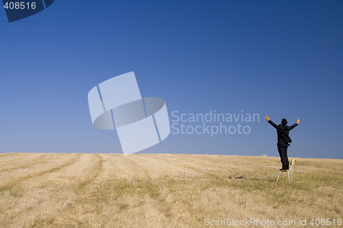 Image of outstretch businessman