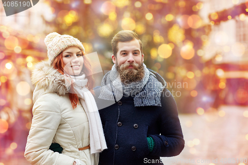 Image of happy couple walking in old town