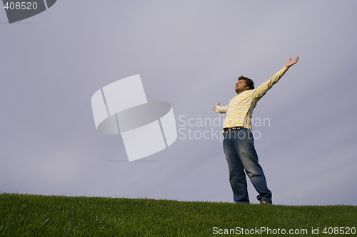 Image of young man in the grass