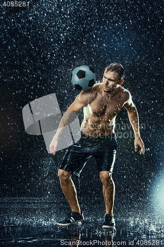 Image of Water drops around football player