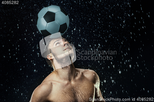 Image of Water drops around football player