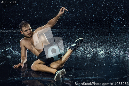 Image of Water drops around football player