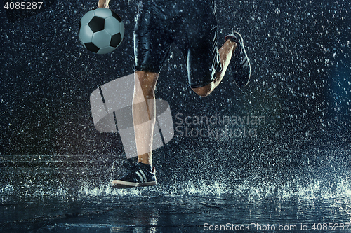 Image of Water drops around football player