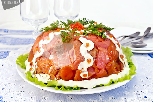 Image of Salad with salmon in plate on tablecloth