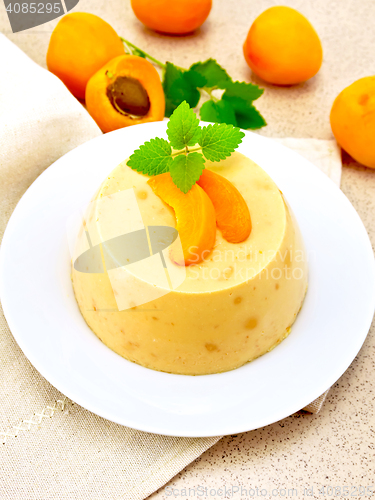 Image of Panna cotta apricot with fruit on table