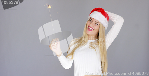 Image of Beautiful adorable girl having fun with sparkler