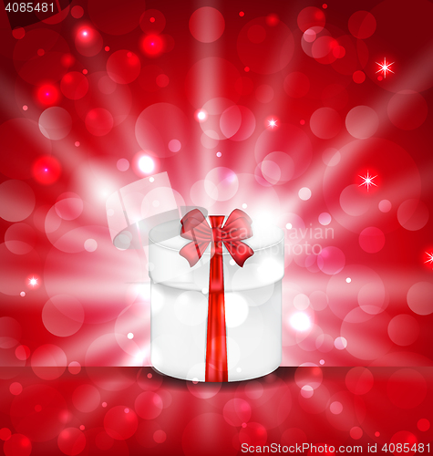 Image of Round gift box on light red background with glow