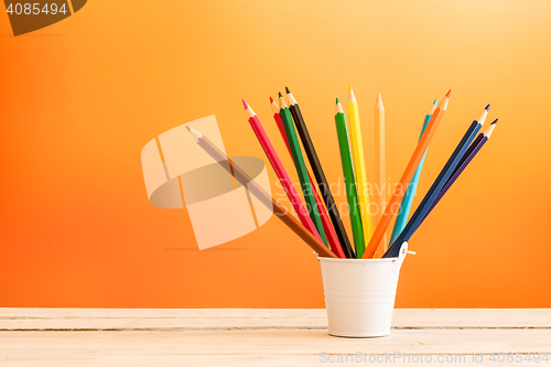 Image of Color pencils in a white bucket