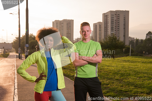 Image of Portrait of romantic pretty couple on fitness session, outside t