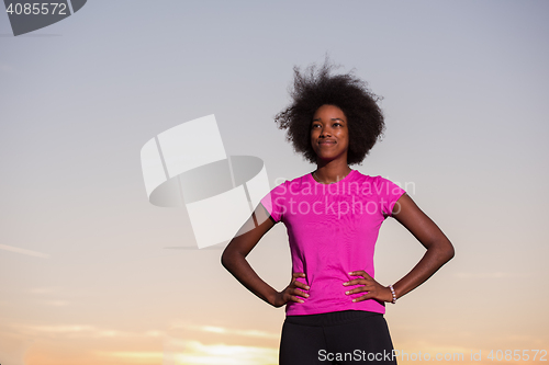 Image of Portrait of a young african american woman running outdoors