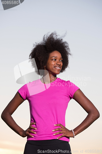 Image of Portrait of a young african american woman running outdoors