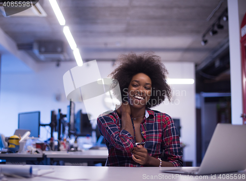 Image of portrait of a young successful African-American woman in modern 