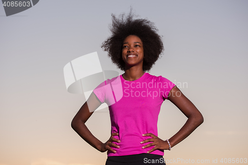 Image of Portrait of a young african american woman running outdoors