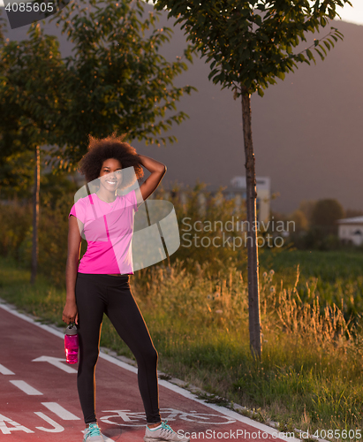 Image of Portrait of a young african american woman running outdoors