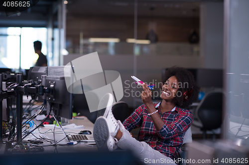 Image of portrait of a young successful African-American woman in modern 