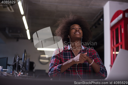 Image of portrait of a young successful African-American woman in modern 