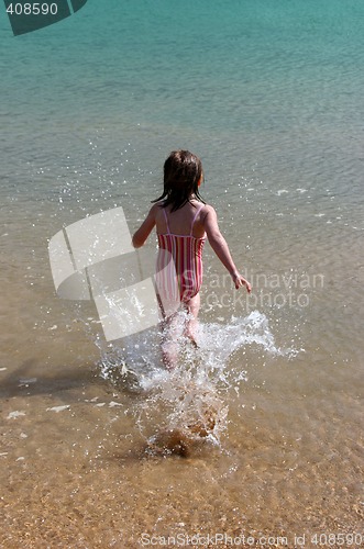 Image of Girl running into the water