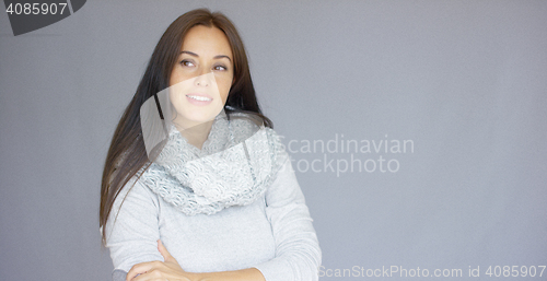 Image of Elegant middle aged woman posing with woolen warm scarf