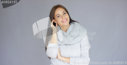 Image of Gorgeous brunette woman posing isolated on gray background