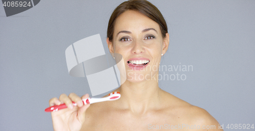 Image of Smiling young woman with clean white teeth