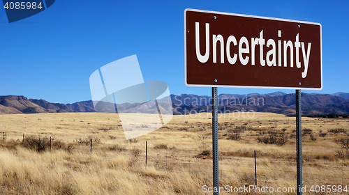 Image of Uncertainty brown road sign