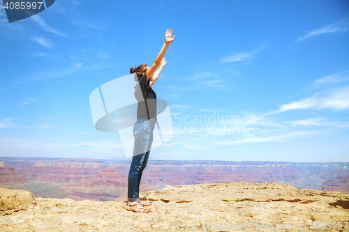 Image of Young lady at the edge of the Grand Canyon rim