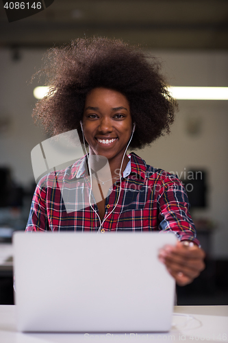 Image of portrait of a young successful African-American woman in modern 