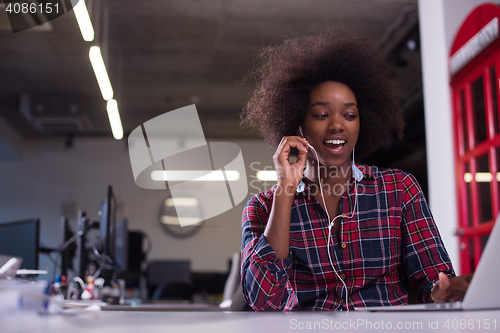 Image of portrait of a young successful African-American woman in modern 